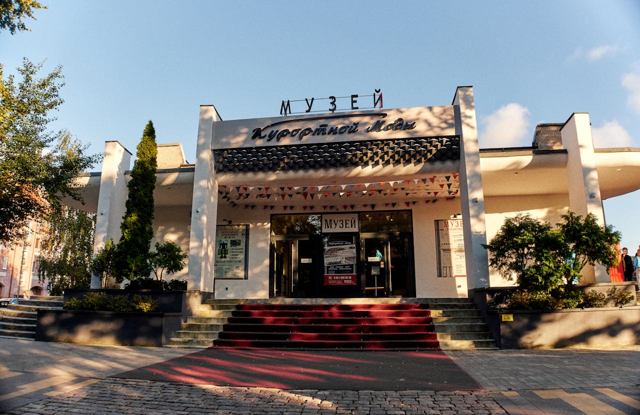 The entrance to a building with a red carpet